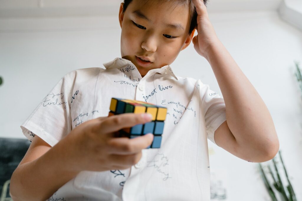 Boy Holding a Rubik's Cube